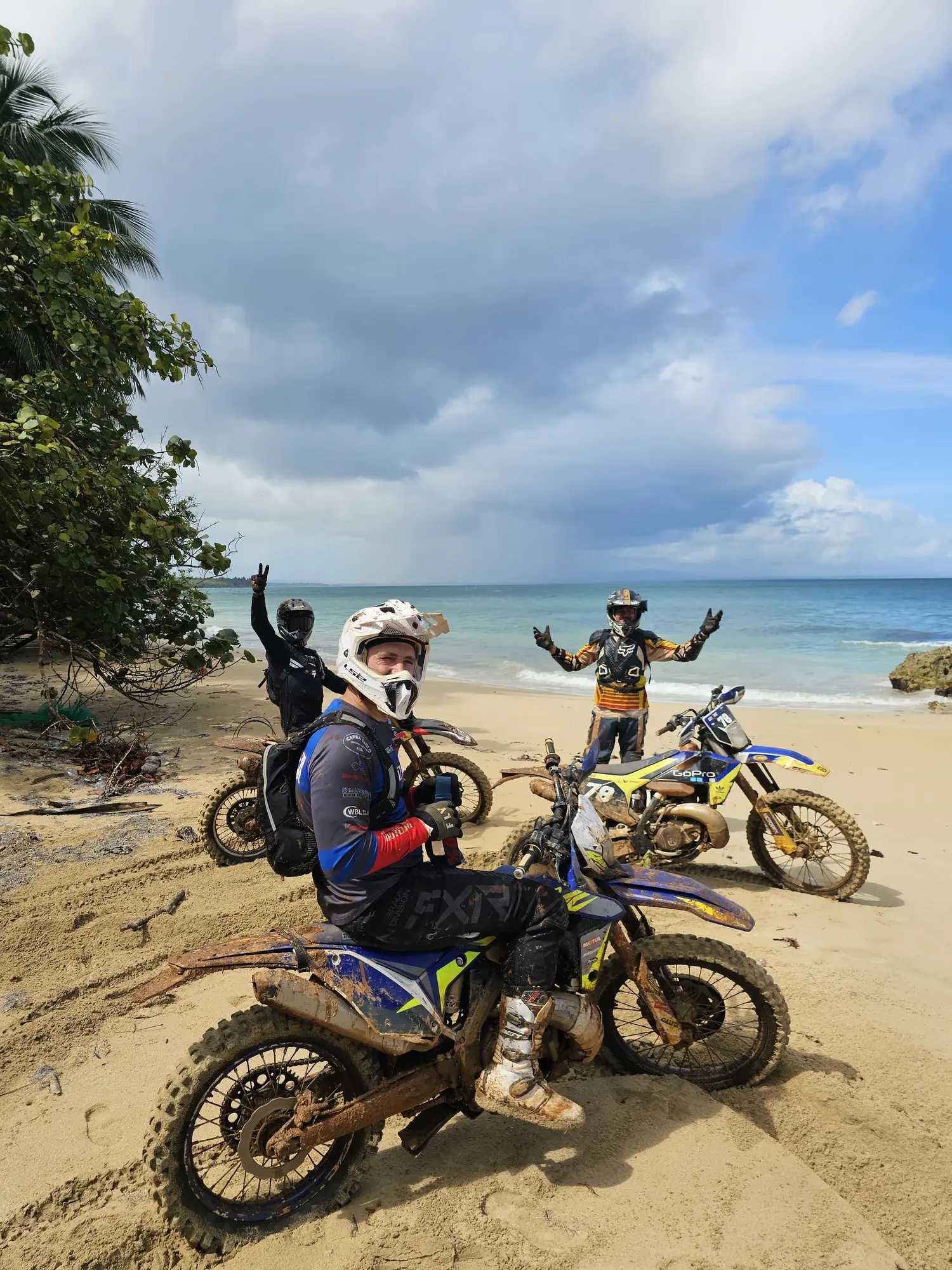 Riders celebrating on the beach