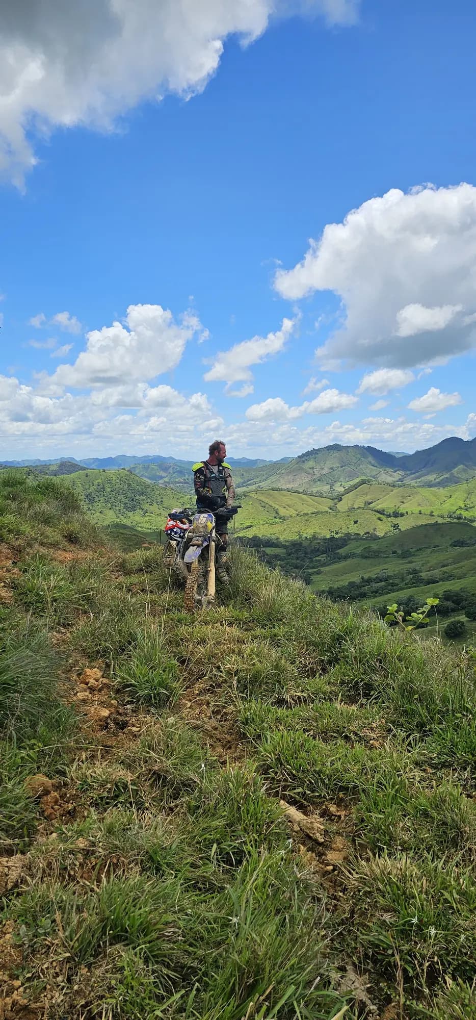 Rider on a grassy mountain ridge