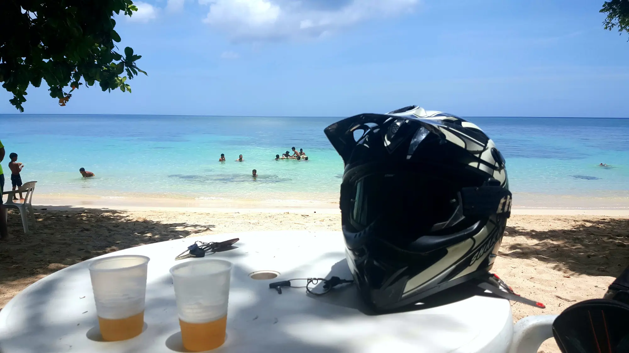 Helmet and cold drinks at a beach stop