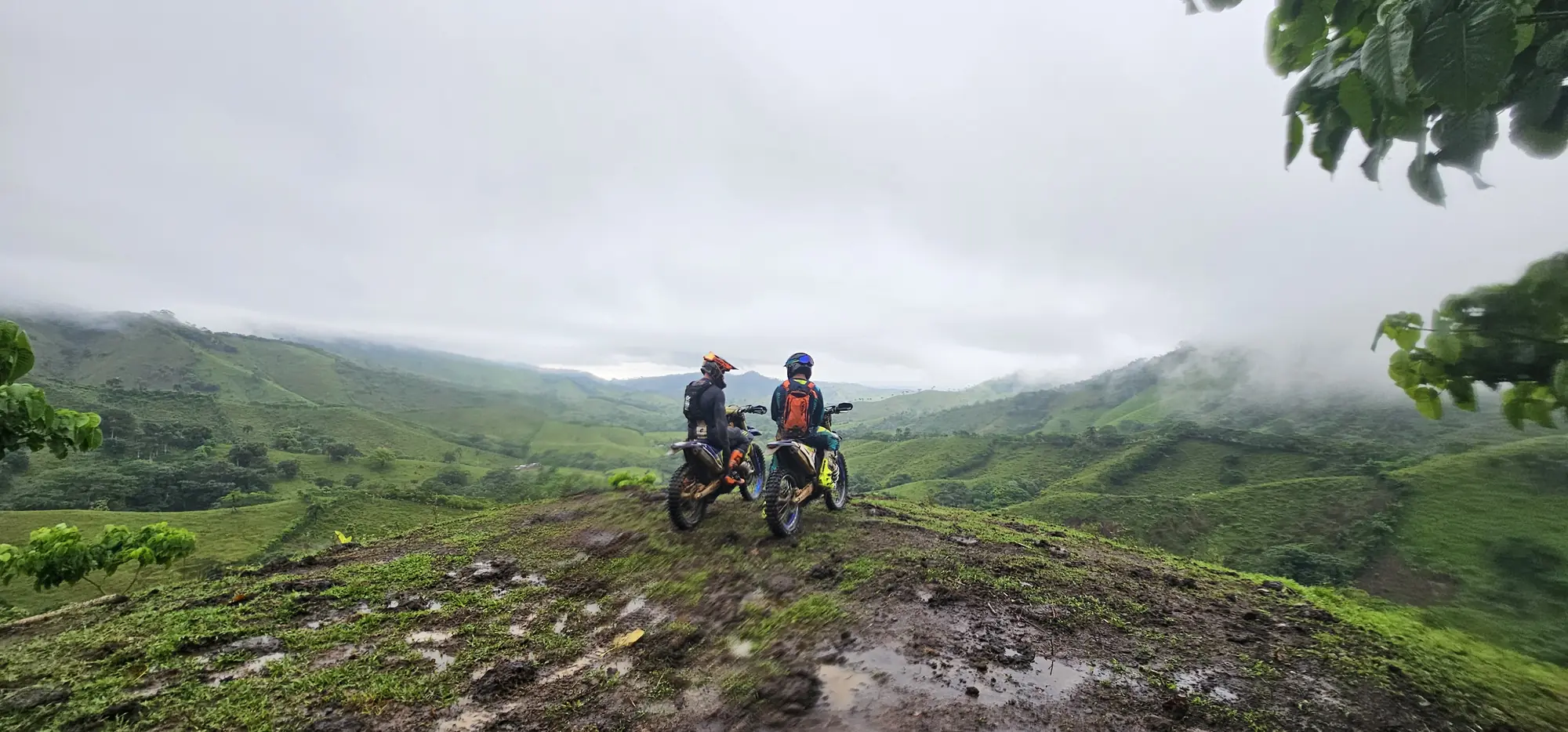 Two riders on a misty mountain lookout