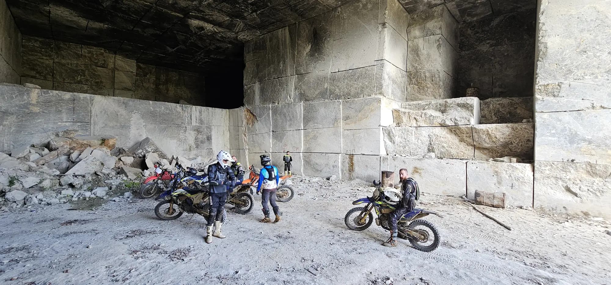 Riders inside a white rock quarry