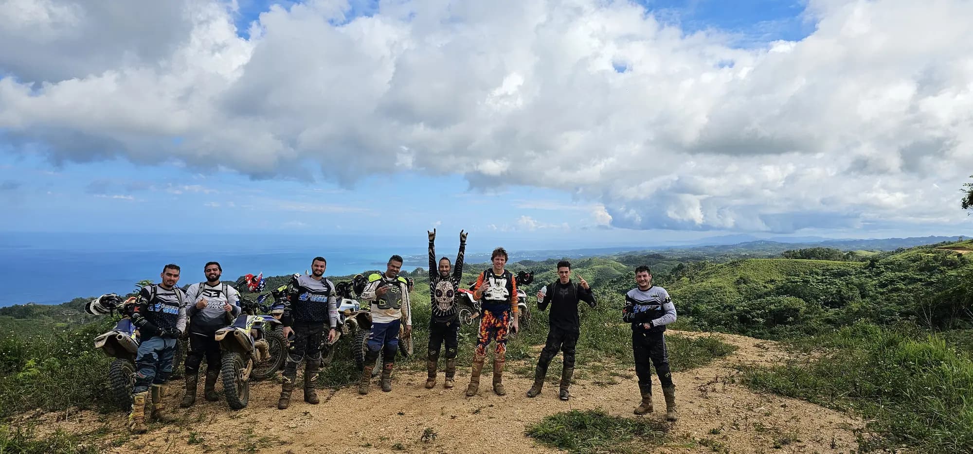 The whole group on a hilltop